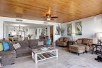 Spacious living space with sectional sleeper sofa and plush sitting chairs
